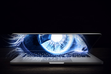Female eye from laptop . Mixed media