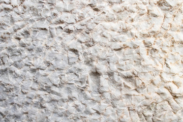 abstract white textures of a Roman marble wall. Abstract minimalist white background of ancient marble