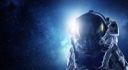 Obraz na płótnie Canvas Astronaut pioneer doing research. Mixed media