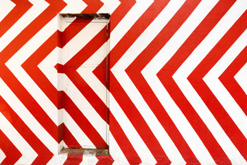 Red and white door. Conceptual street art on madrid street