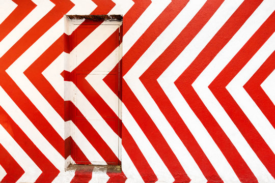 Red And White Door. Conceptual Street Art On Madrid Street