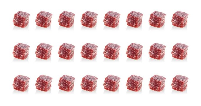 Multi-colored sweets blink on a white background. Turkish dessert Turkish delight on a white background