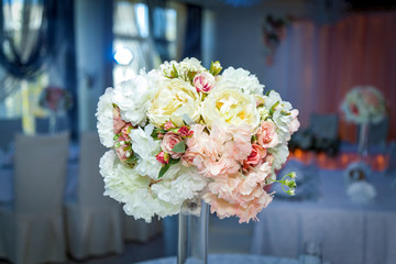 A wedding bouquet in a vase on the table