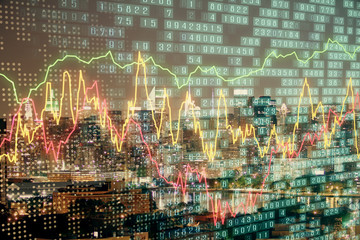Double exposure of forex chart drawings over cityscape background. Concept of success.