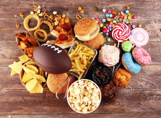 chicken wings, fries and onion rings for football on a table. Great for Bowl Game party