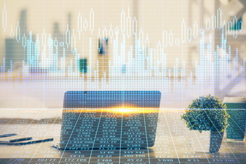 Double exposure of chart and financial info and work space with computer background. Concept of...
