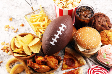 chicken wings, fries and onion rings for football on a table. Great for Bowl Game party - 319405982