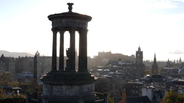 View from Calton Hill in Edinburgh, Scotland in late afternoon. View or cityscape skyline with Castle in the distance. Crane up