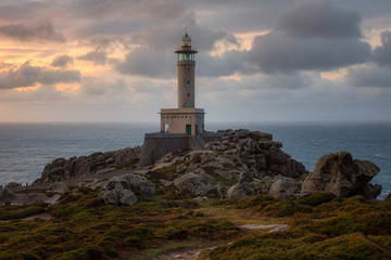 Punta Nariga lighthouse at sunset. Galicia, Spain