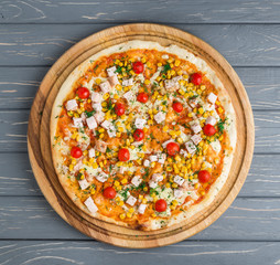 Popular pizza topping in American-style pizzerias on wooden background