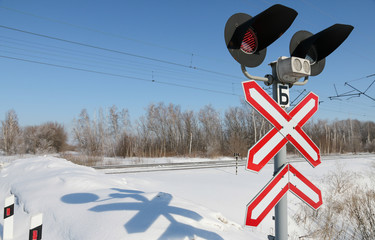 sign adjustable railway crossing equipped with a semaphore, signal columns.