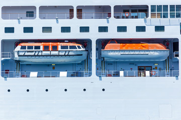 Many lifeboats on the big cruise ship