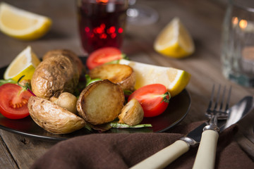 Beef Steak and Side Dish of Baked Potatoes and Mushrooms