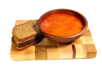 Solyanka and rye bread . A spicy soup of vegetables and meat or fish. Isolated.