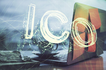 Double exposure of blockchain theme hologram and table with computer background. Concept of bitcoin crypto currency.