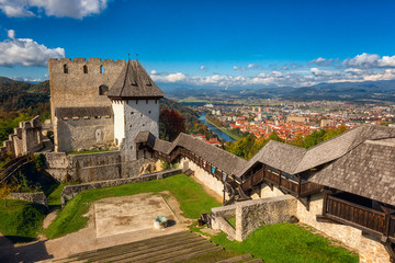 Fototapeta na wymiar Celje Old castle (Celjski Stari grad), amazing aerial view of medieval fortification and town of Celje in Lasko valley in Julian Alps mountains, Slovenia, Styria. Outdoor travel background