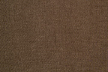Fototapeta na wymiar The fabric is brown linen. Brown Textile Drapery