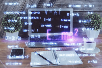 Desktop computer background and formula hologram writing. Double exposure. Education concept.