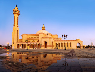 Beautiful view of Al Fateh Grand Mosques with reflection in the water on the morning, Manama Bahrain.