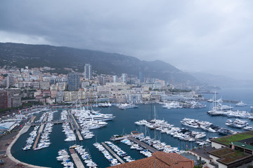Fototapeta premium Monaco bay with lot of boats on a rainy day.