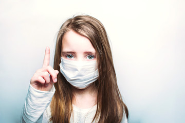 Child in a medical mask, protection against flu and colds