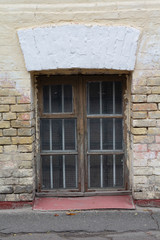 Old wooden window of the basement. Architecture