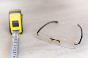 measuring tape and glasses