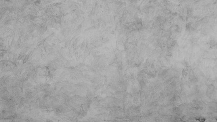 Clean light gray concrete wall texture for background.