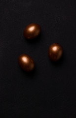 Easter eggs on a black background. Minimalism concept