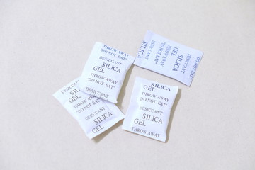 Paper packet of silica gel isolated on white background.