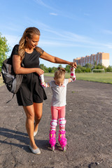 Child learns to roller skate. Roller skating