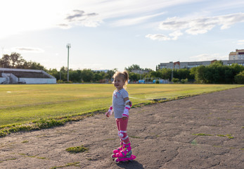 Child learns to roller skate. Roller skating