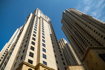 Fototapeta na wymiar High skyscrapers of Dubai blue-toned