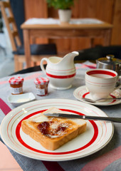 Breakfast with toast, butter and jam