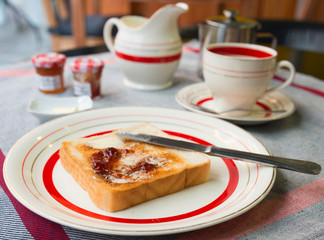 Breakfast with toast, butter and jam