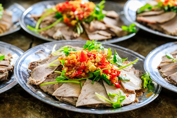 Delicious dried beef slices cold dish,the ingredients are red pepper and garlic with coriander.Chinese food.