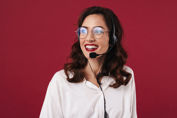 Woman work in callcenter talking by cellphone.