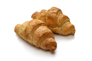 Two mini croissants made of puff pastry with cream