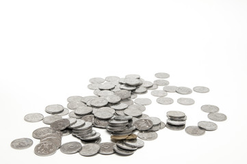 A lot of coins are scattered. The concept of wealth and abundance. On white background