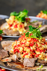 Delicious dried beef slices cold dish,the ingredients are red pepper and garlic with coriander.Chinese food.