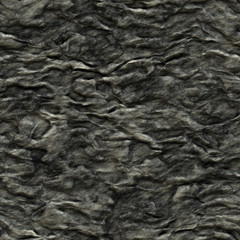 Surface of dark and sharp eroded rock