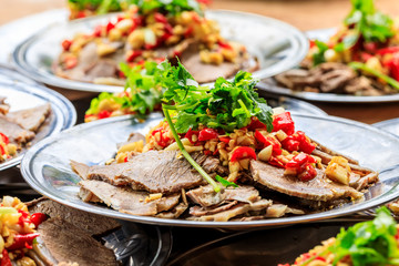 Delicious dried beef slices cold dish,the ingredients are red pepper and garlic with coriander.Chinese food.