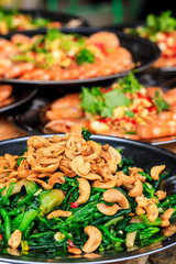 Delicious spinach cold dish,the ingredients are chili and garlic with cashews.Chinese food.