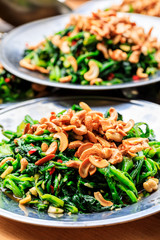 Delicious spinach cold dish,the ingredients are chili and garlic with cashews.Chinese food.