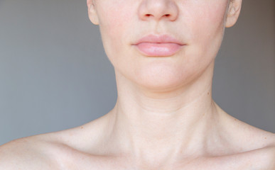 the woman has wrinkles on her neck - obrazy, fototapety, plakaty