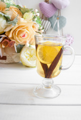 glass of tea with lemon on a wooden table