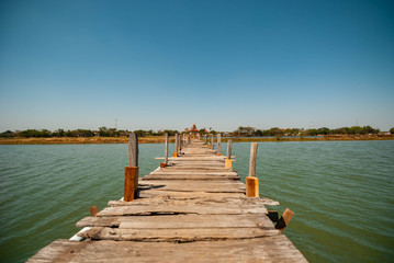 Wooden bridges, walkways constructed with old wood and local wisdom to walk across the river.