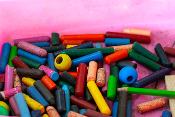 Multicolored pastel colors A broken colored rod was dropped into the box.