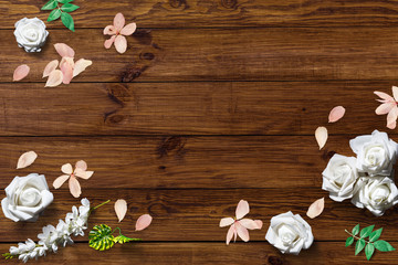 White roses on wooden background. Selective focus, copy space