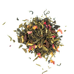 pile of natural green tea mix contains peach, orange petals, dried cranberries, rose petals